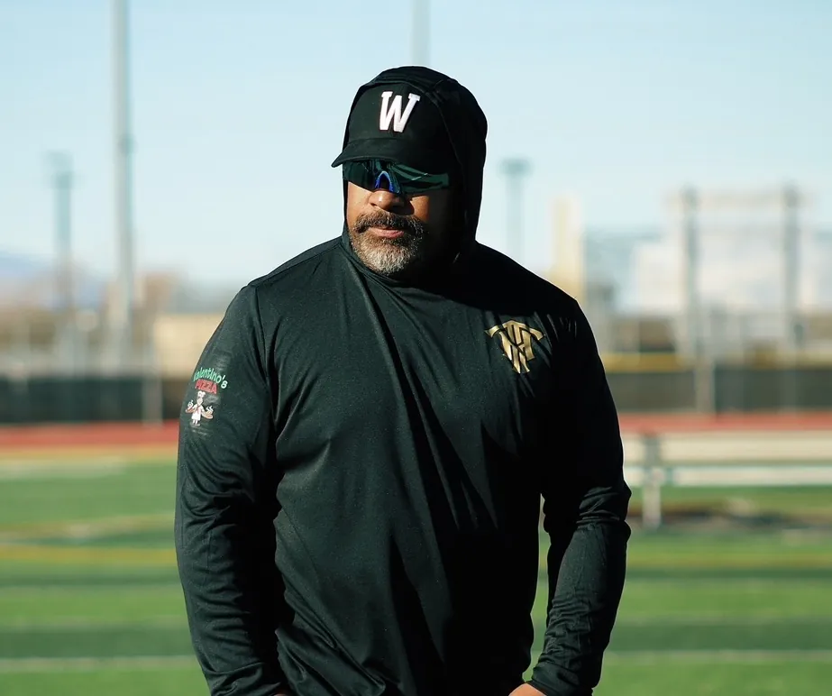 Trench House coach on the field during warm-ups