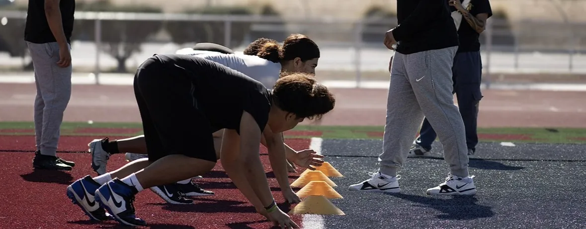 Linemen working drill progressions during a Trench House session
